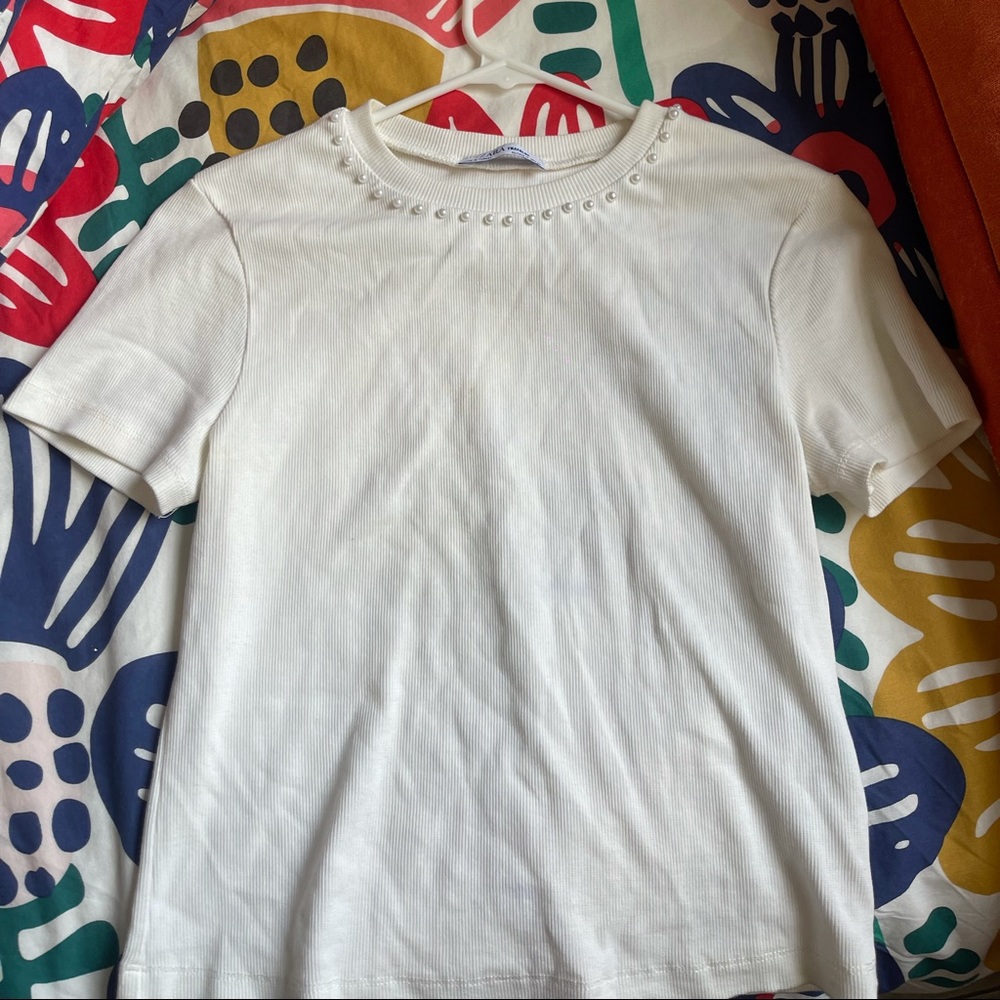 Cream pearl top
